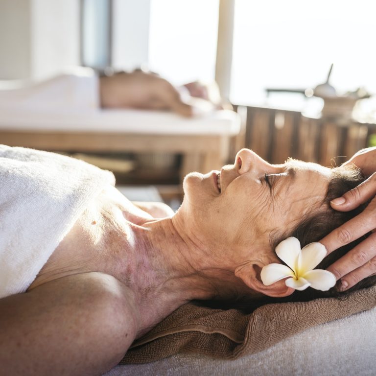 Massage therapist massaging at a spa