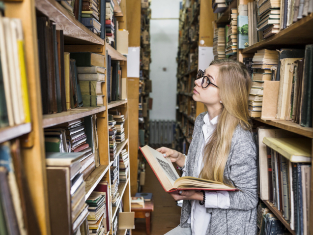 woman-with-book-looking-up